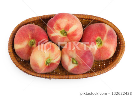 chinese flat donut peaches in a wicker basket isolated on white background. Top view. Flat lay 132622428