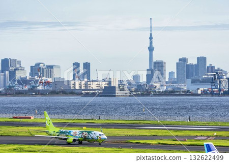 View of Haneda Airport, taxiing planes and Skytree, Ota Ward, Tokyo 132622499