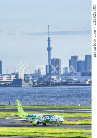 View of Haneda Airport, taxiing planes and Skytree, Ota Ward, Tokyo View of Haneda Airport, taxiing planes and Skytree, Ota Ward, Tokyo 132622500