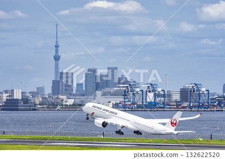 Scenery of Haneda Airport, plane taking off and Tokyo Skytree, Ota Ward, Tokyo 132622520