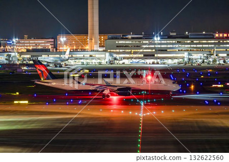 Haneda Airport at night, airplane taxiing, Ota Ward, Tokyo 132622560