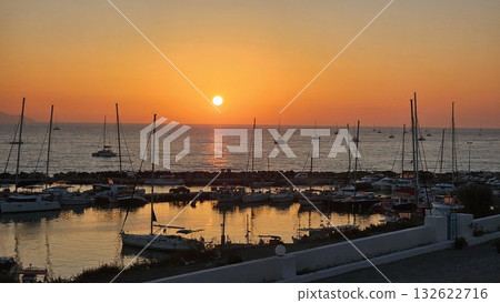 view of a marina filled with boats at sunset view of a marina filled with boats at sunset 132622716