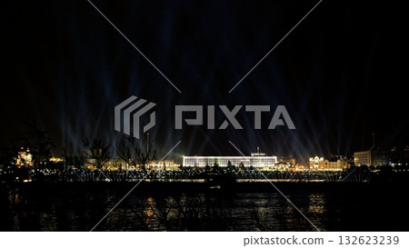 illumination checks on waterfront at night, performing comprehensive lighting diagnostics on dockside stage, conducting thorough light testing across empty piers with industrial background and blue 132623239