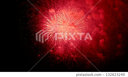 heartshaped flames light up sky, crimson heartshaped fireworks burst with smoky halo in night sky, bright red heartshaped fireworks illuminate dark sky with warm glowing aura and pulsating center 132623240