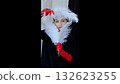 Studio portrait of fashion model wearing long red gloves, posing with white ostrich feathers, conveying high end glamour and dramatic styling 132623255