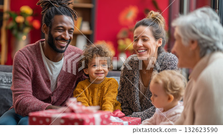 Multigenerational family gathering, celebrating holidays and exchanging presents, laughing and enjoying time together Multigenerational family gathering, celebrating holidays and exchanging presents, laughing and enjoying time together 132623590