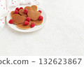 A heap of heart shaped pancakes with raspberries on the white plate on the white background 132623867
