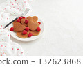 A heap of heart shaped pancakes with raspberries and a fork on the white plate on white background 132623868