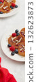 Web banner of heap of heart shaped pancakes with berries on the white plate on grey background 132623873