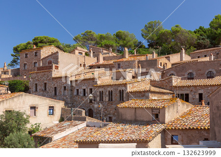 Stone houses with tiled roofs in Tossa de Mar Spain Stone houses with tiled roofs in Tossa de Mar Spain 132623999