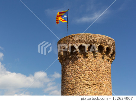 Stone tower with Catalonia flag in Tossa de Mar Spain Stone tower with Catalonia flag in Tossa de Mar Spain 132624007