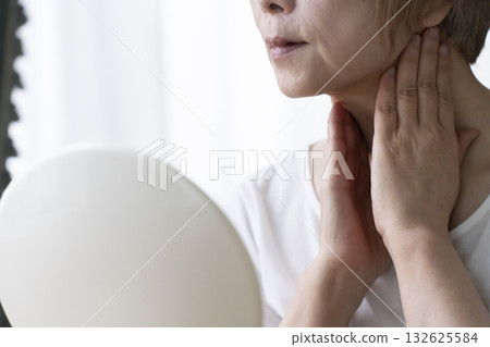 Senior woman worried about facial aging 132625584