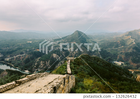 Aerial view of Simatai section of Great Wall of China in its original, un-restored state. Watchtowers perched on mountain peaks, Beijing, China. High quality photo 132626432