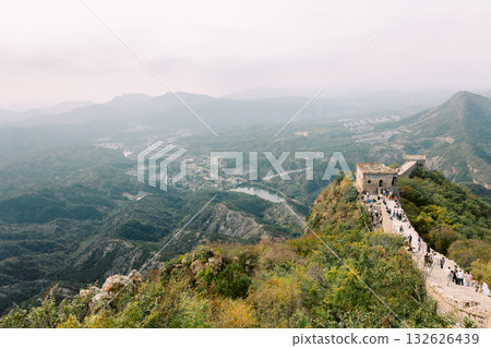 Aerial view of Simatai section of Great Wall of China in its original, un-restored state. Watchtowers perched on mountain peaks, Beijing, China. High quality photo Aerial view of Simatai section of Great Wall of China in its original, un-restored state. Watchtowers perched on mountain peaks, Beijing, China. High quality photo 132626439