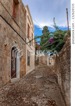 Street view of old town of Rhodes, Greece. Paved roads and pavements with colorful houses and fragrant flowers. High quality photo Street view of old town of Rhodes, Greece. Paved roads and pavements with colorful houses and fragrant flowers. High quality photo 132626535