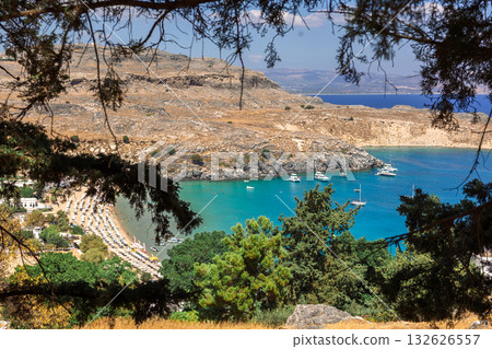 Panoramic view of colorful harbor in Lindos village, Rhodes. Aerial view of beautiful landscape, sea with sailboats and coastline of island of Rhodes in Aegean Sea. High quality photo 132626557