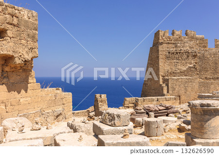 Panoramic view of ruins of ancient city of Lindos on colorful island of Rhodes, Greece. Famous tourist attraction. Ancient temple Greek architecture. High quality photo 132626590