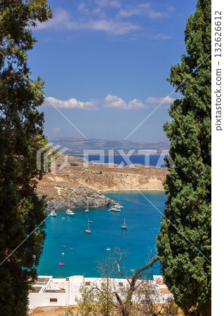 Panoramic view of colorful harbor in Lindos village, Rhodes. Aerial view of beautiful landscape, sea with sailboats and coastline of island of Rhodes in Aegean Sea. High quality photo Panoramic view of colorful harbor in Lindos village, Rhodes. Aerial view of beautiful landscape, sea with sailboats and coastline of island of Rhodes in Aegean Sea. High quality photo 132626612