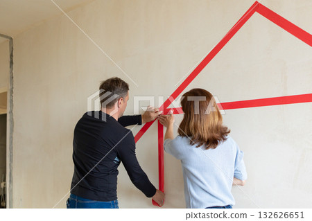 Man hugging his wife. Young couple moving in new apartmen. Concept new homes, new beginning. High quality photo 132626651