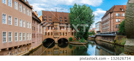 Famous view of Glasses of Nuremberg Heilig-Geist-Spital in old city. Beautiful reflection of the arch of the house in the shape of glasses, Nuremberg in Franconia, Bavaria, Germany.  132626734