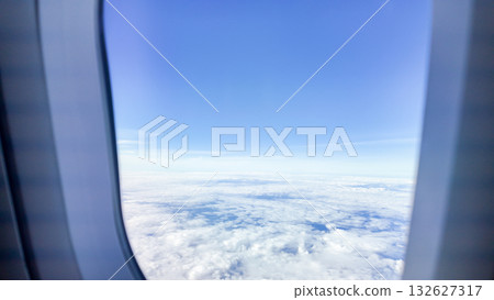beautiful blue sky with white clouds view from airplane window 132627317