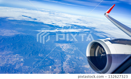 beautiful blue sky with white clouds view from airplane window 132627323