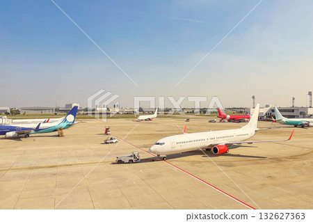 Commercial airplane at the airport with clear blue sky background 132627363