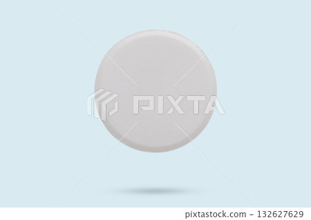 White medicine pill tablet flying on background White medicine pill tablet flying on background 132627629