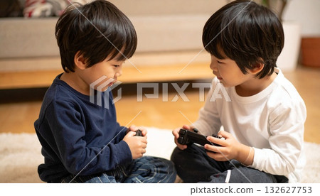 Two Japanese boys playing online games 132627753
