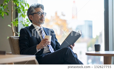 A businessman in his 50s taking a coffee break A businessman in his 50s taking a coffee break 132627755