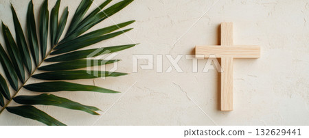 Palm Sunday symbol with wooden cross and green palm leaves, suitable for backgrounds 132629441