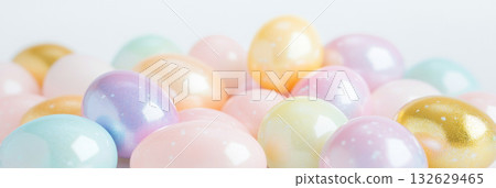 Easter pastel eggs nestled in grass and flowers with soft focus, background 132629465