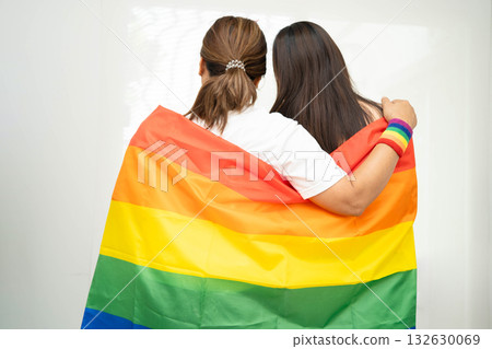 Asian couple woman with LGBT rainbow flag. Asian couple woman with LGBT rainbow flag. 132630069