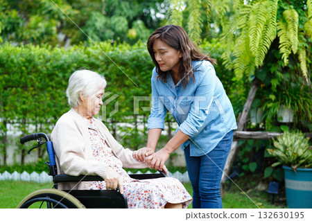 Caregiver help Asian elderly woman disability patient sitting on wheelchair in park, medical. Caregiver help Asian elderly woman disability patient sitting on wheelchair in park, medical. 132630195