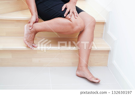 Asian lady woman injury from falling down on slippery surfaces stairs at home. Asian lady woman injury from falling down on slippery surfaces stairs at home. 132630197