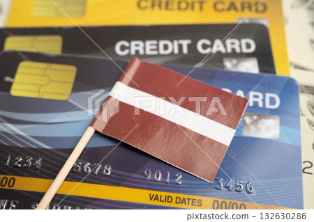 Latvian flag on credit card, finance economy trading shopping online business. 132630286