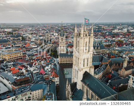 Aerial footage showcasing Ghents gothic towers and dense urban heritage below Aerial footage showcasing Ghents gothic towers and dense urban heritage below 132630465