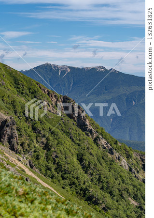 Mt. Kannon of the Houou Sanzan mountains seen from the Daimonzawa descent point. Climbing Mt. Ainotake and Mt. Notori of the Shiramine Sanzan mountains in the Southern Alps. 132631825