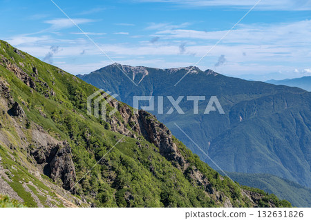 Mt. Kannon of the Houou Sanzan mountains seen from the Daimonzawa descent point. Climbing Mt. Ainotake and Mt. Notori of the Shiramine Sanzan mountains in the Southern Alps. 132631826
