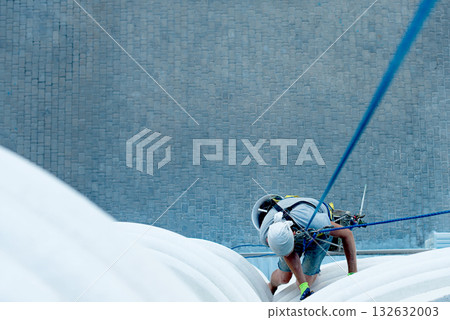 high-altitude climber. The profession of working at height. high-altitude climber. The profession of working at height. 132632003