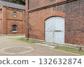 Red bricks and a large door 132632874