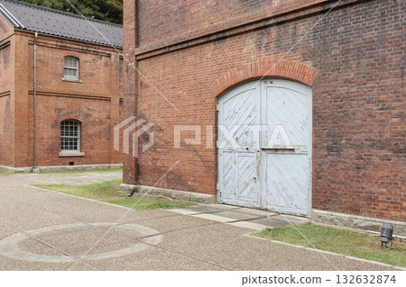 Red bricks and a large door Red bricks and a large door 132632874