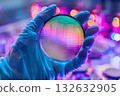 A technician working with semiconductor wafers (cutting-edge electronic component manufacturing process) 132632905