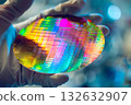 A technician working with semiconductor wafers (cutting-edge electronic component manufacturing process) 132632907