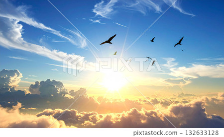 A majestic blue sky and sea of clouds, shining with the sun and flocks of birds, leading to hope and success A majestic blue sky and sea of clouds, shining with the sun and flocks of birds, leading to hope and success 132633128