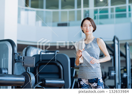 Middle-aged woman at the fitness gym. Photo courtesy of Sports Club & Sauna Spa Renaissance Makuhari 24 132633984