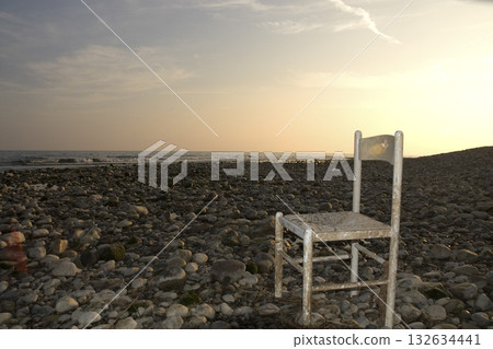 abandoned wooden chair on the seashore abandoned wooden chair on the seashore 132634441