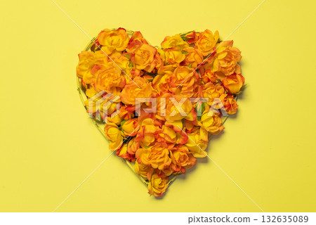 beautiful heart shape of yellow roses on a bright yellow background beautiful heart shape of yellow roses on a bright yellow background 132635089