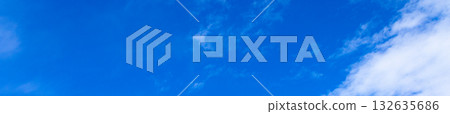 A simple landscape of blue sky and clouds 132635686