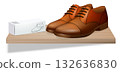 Brown leather shoes with care box. Clean retail layout. A realistic product scene for fashion and branding. 132636830
